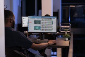 A developer at a computer coding a custom FreeSWITCH voice application