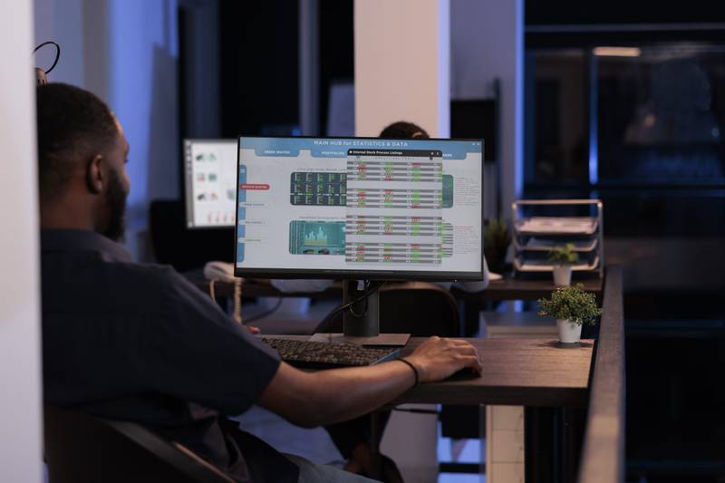 A developer at a computer coding a custom FreeSWITCH voice application